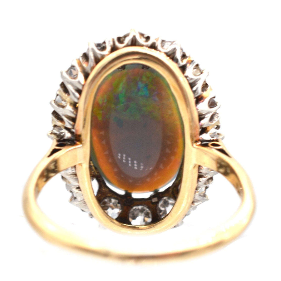 Large Victorian 18ct gold ring featuring a stunning black opal and diamond cluster setting.