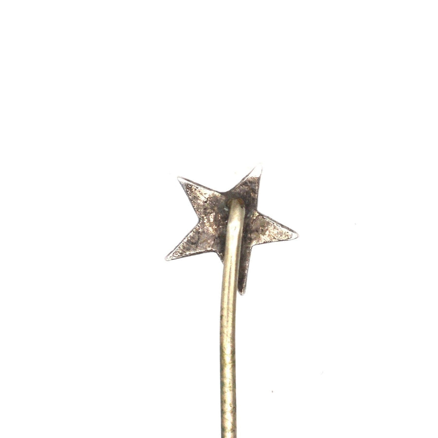 Viktorianische Silberstern-Krawattennadel mit einem türkisfarbenen Zentrum, das Liebe und Erinnerung symbolisiert.