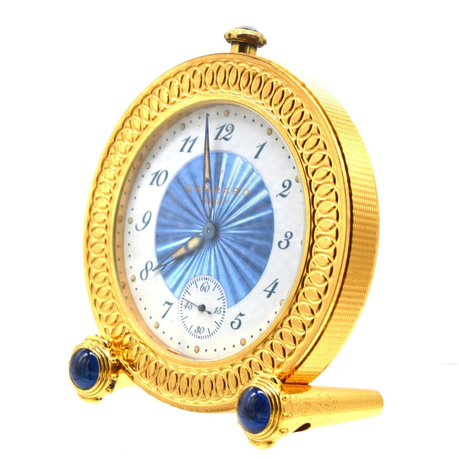 Vintage Garrard Reisewecker aus vergoldetem Metall mit blauem Zifferblatt und Cabochons, limitierte Auflage 127/150, aus dem Jahr 1993.