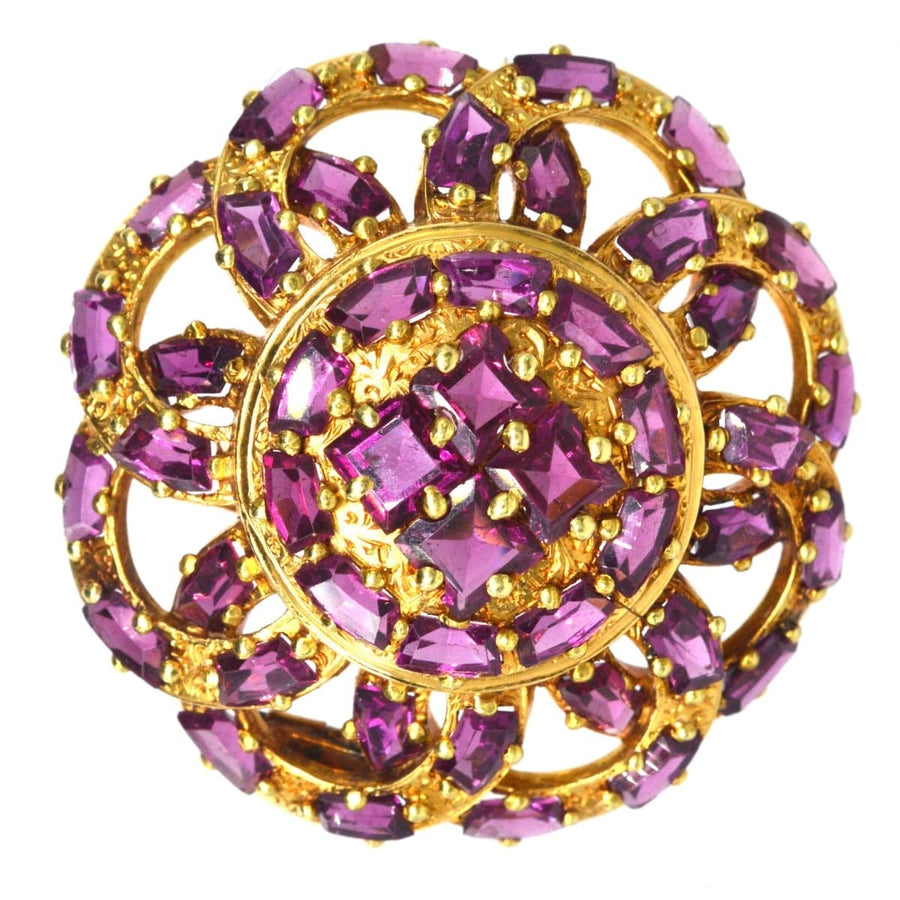19th century French gold brooch with rhodolite garnets, round design, featuring pink and purple gemstones.