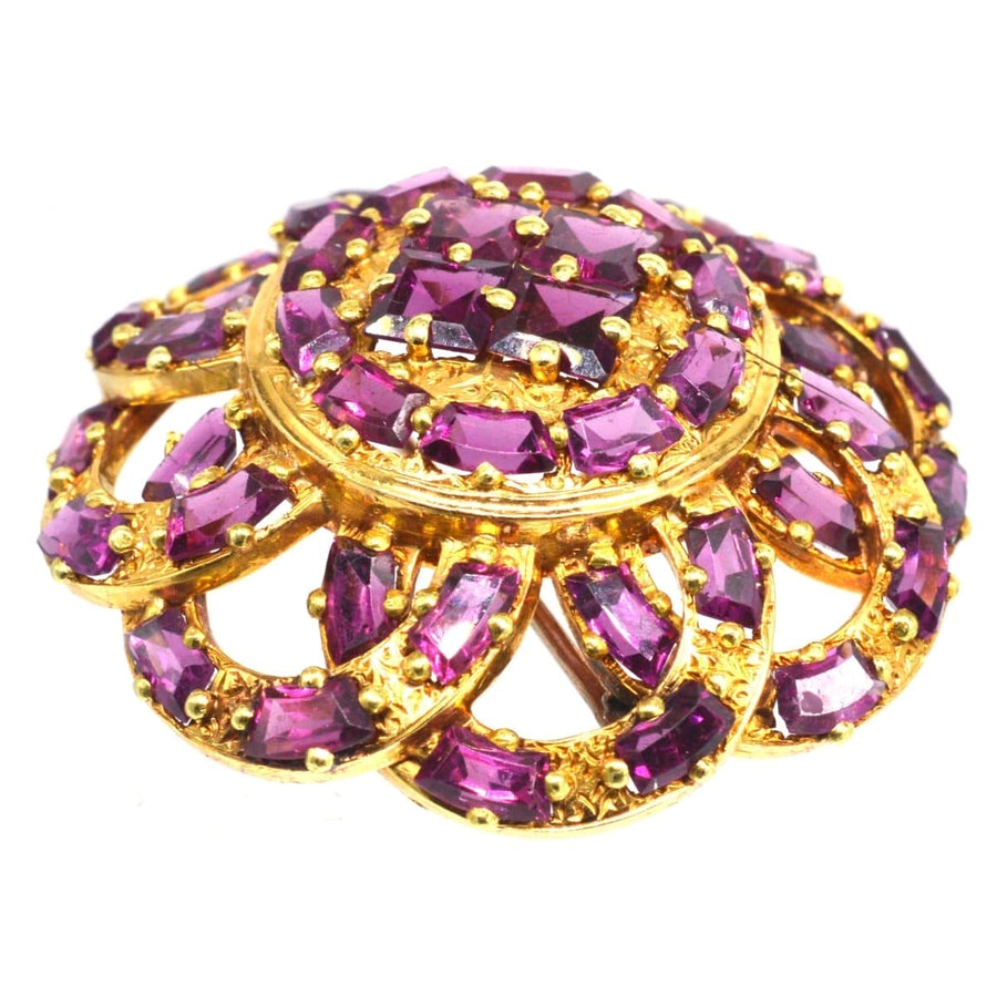 19th century French brooch featuring round rhodolite garnets in gold setting, symbolizing love and passion.