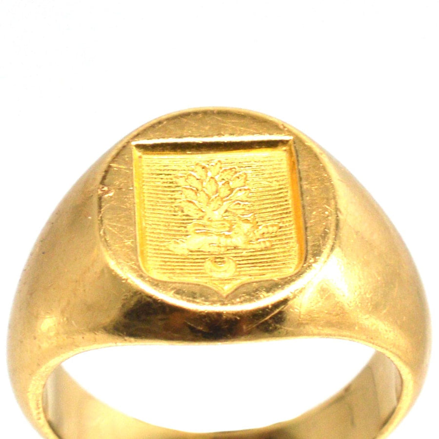 Antique French 18ct gold signet ring with hand engraved armorial shield featuring a lion, tree, and crescent.