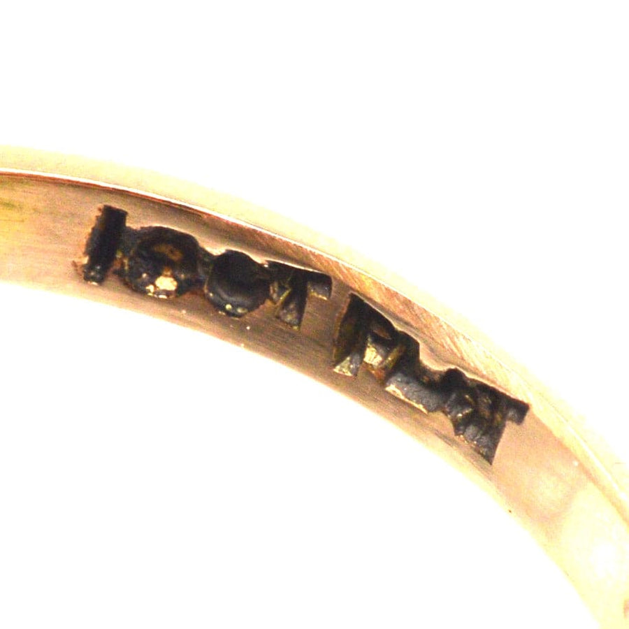 Inside view of a gold ring showing the 18ct gold stamp and craftsmanship.
