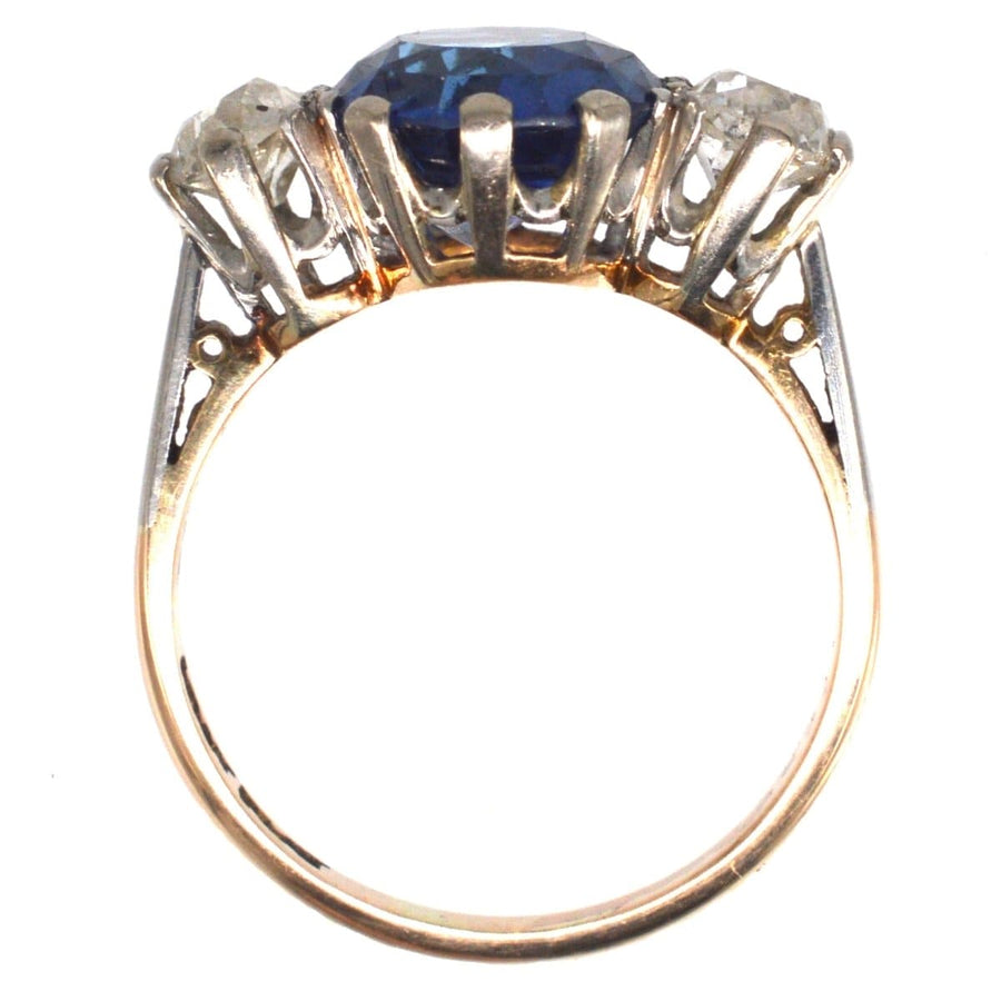 Art Deco 18ct gold and platinum three stone ring with 5.25ct Ceylon sapphire and diamond accents.