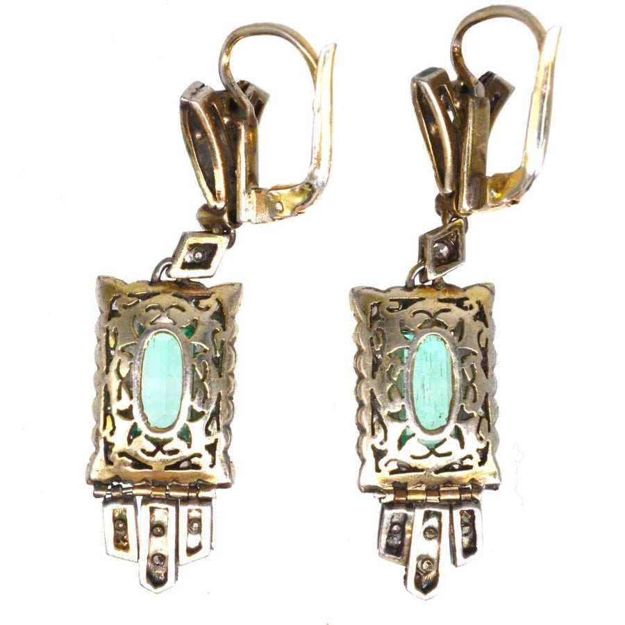 Art Deco 18ct gold drop earrings featuring emeralds and diamonds with elegant geometric design.