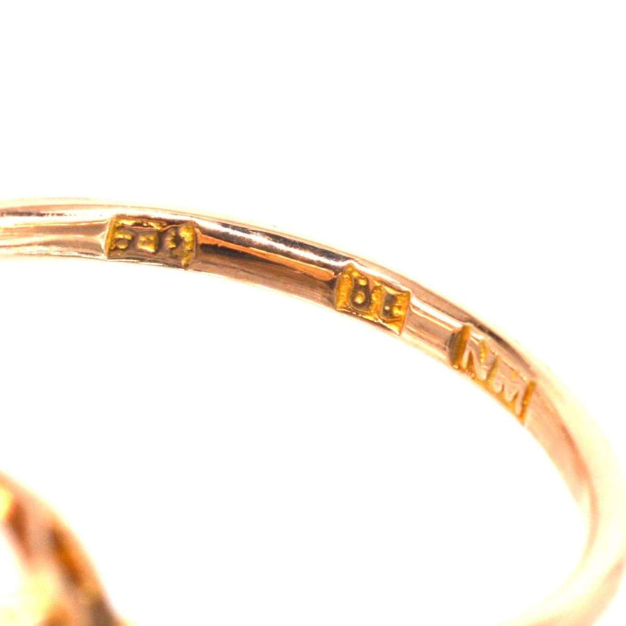 Close-up of the stamp on an Art Deco 18ct gold opal ring, showcasing intricate gold stamps.