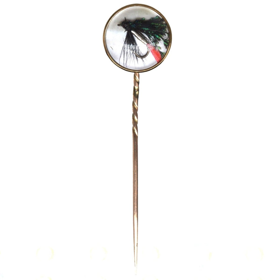 Art Deco 9ct gold tie pin featuring intricate fishing hook and feather design set in mother of pearl.