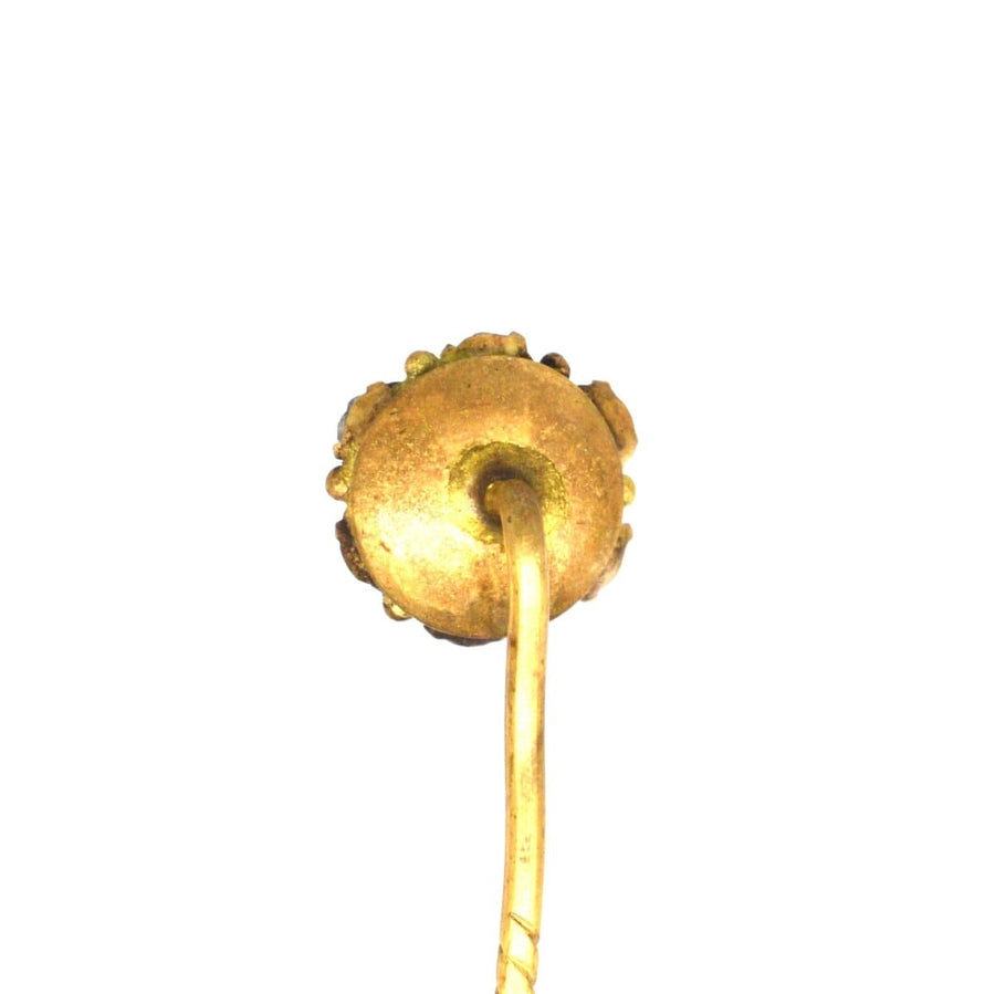 Back view of a vintage Art Deco green and white paste tie pin with a gold finish, showcasing its intricate design and craftsmanship.