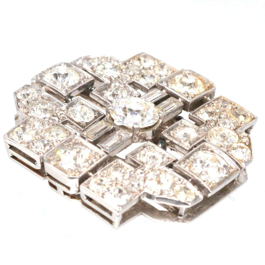 Art Deco platinum brooch featuring 7 carats of sparkling diamonds in a geometric design.
