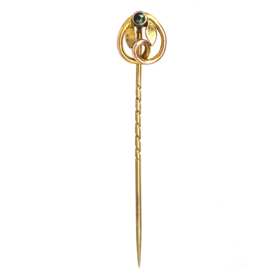Art Nouveau 9ct green garnet topped doublet tie pin with gold leaf design, symbolizing love and new beginnings.