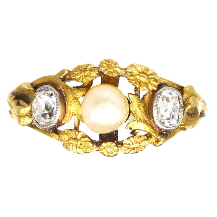 Art Nouveau French 18ct gold ring with natural pearl and old mine cut diamonds, adorned with flowers.