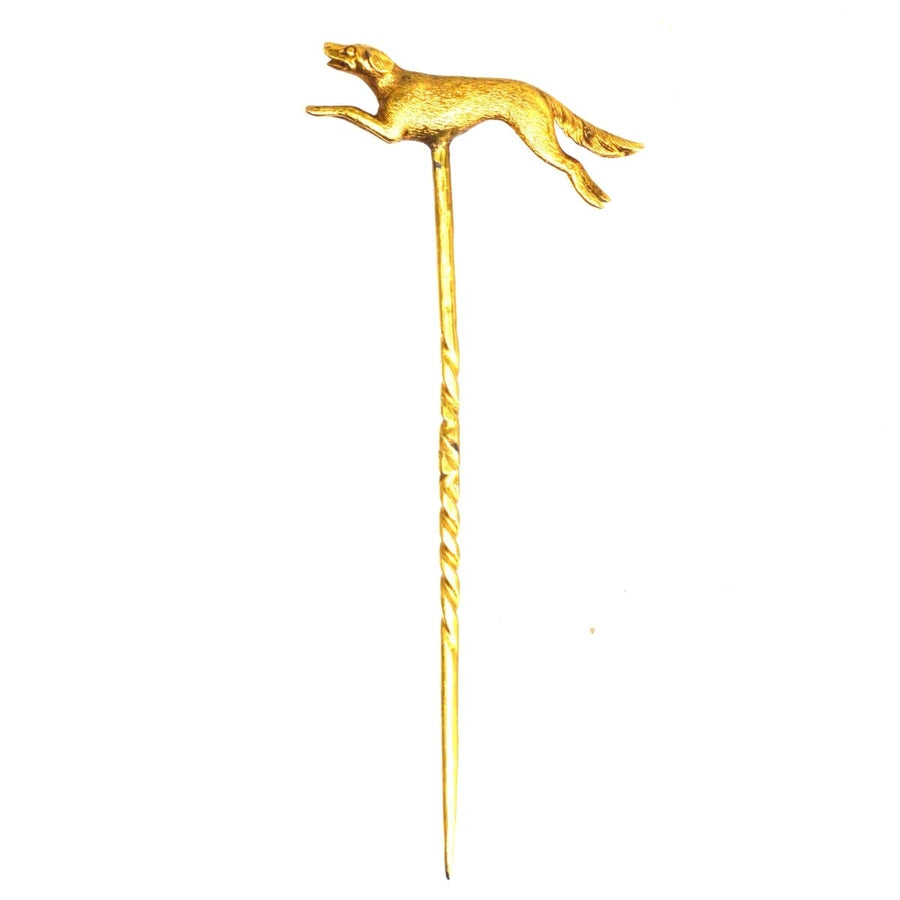 Early 20th century 15ct gold tie pin featuring a running dog, intricately sculpted in pursuit, showcasing classic canine elegance.