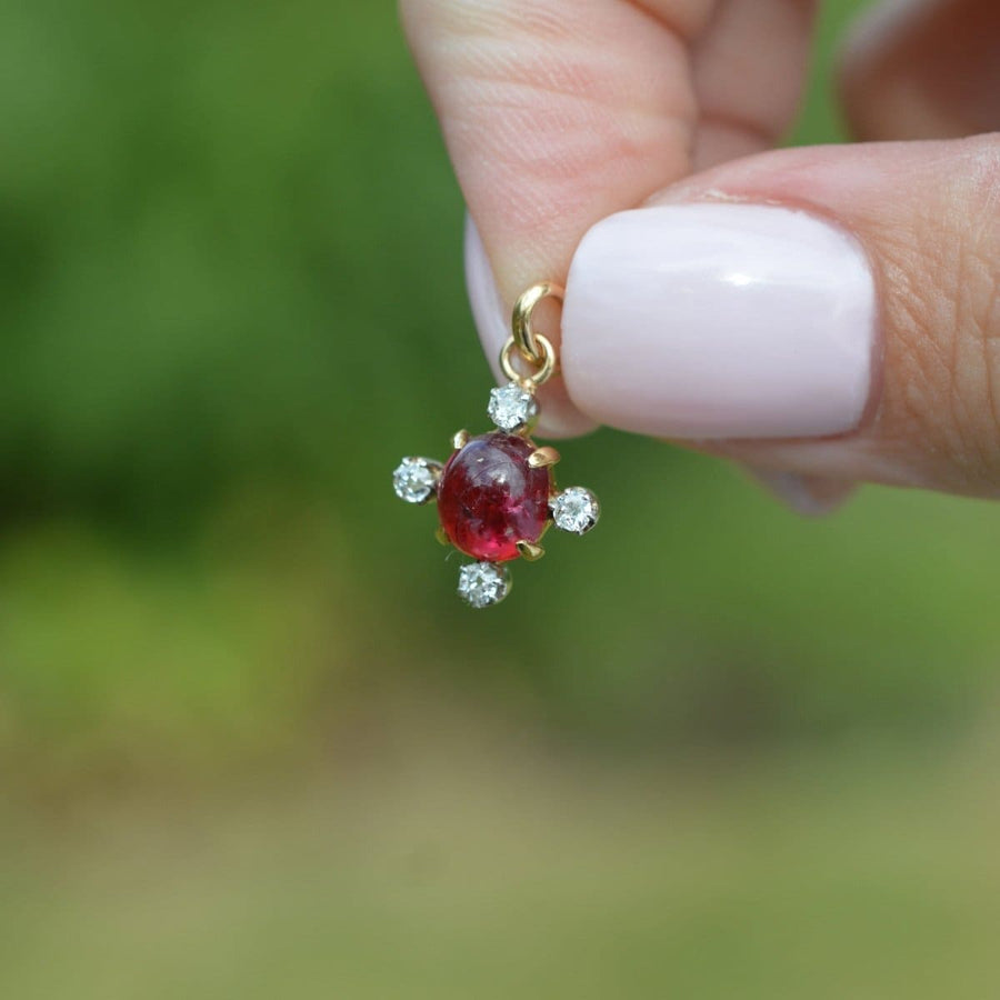 Early 20th century 18ct gold pendant featuring cabochon ruby and diamonds, perfect for elegant jewelry collection.