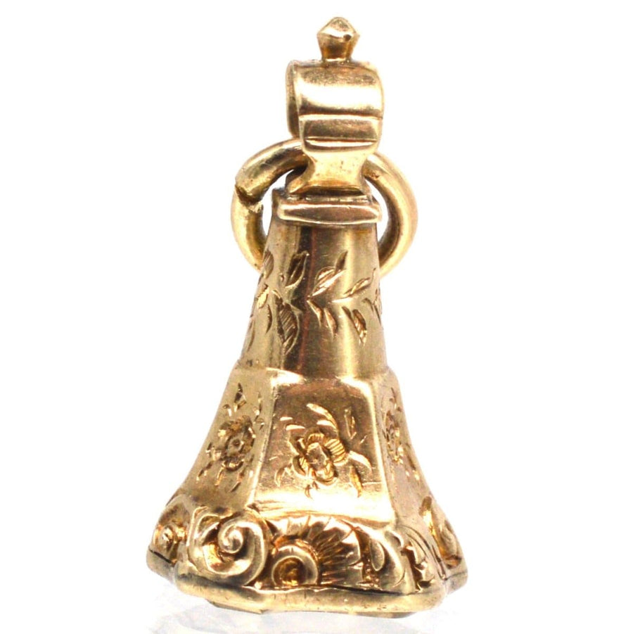 Antique gold bell ornament with floral engravings, showcasing intricate Victorian craftsmanship.