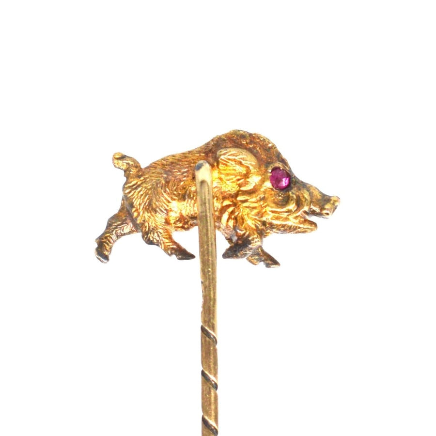 14ct gold wild boar tie pin featuring ruby eyes, symbolizing bravery and craftsmanship.