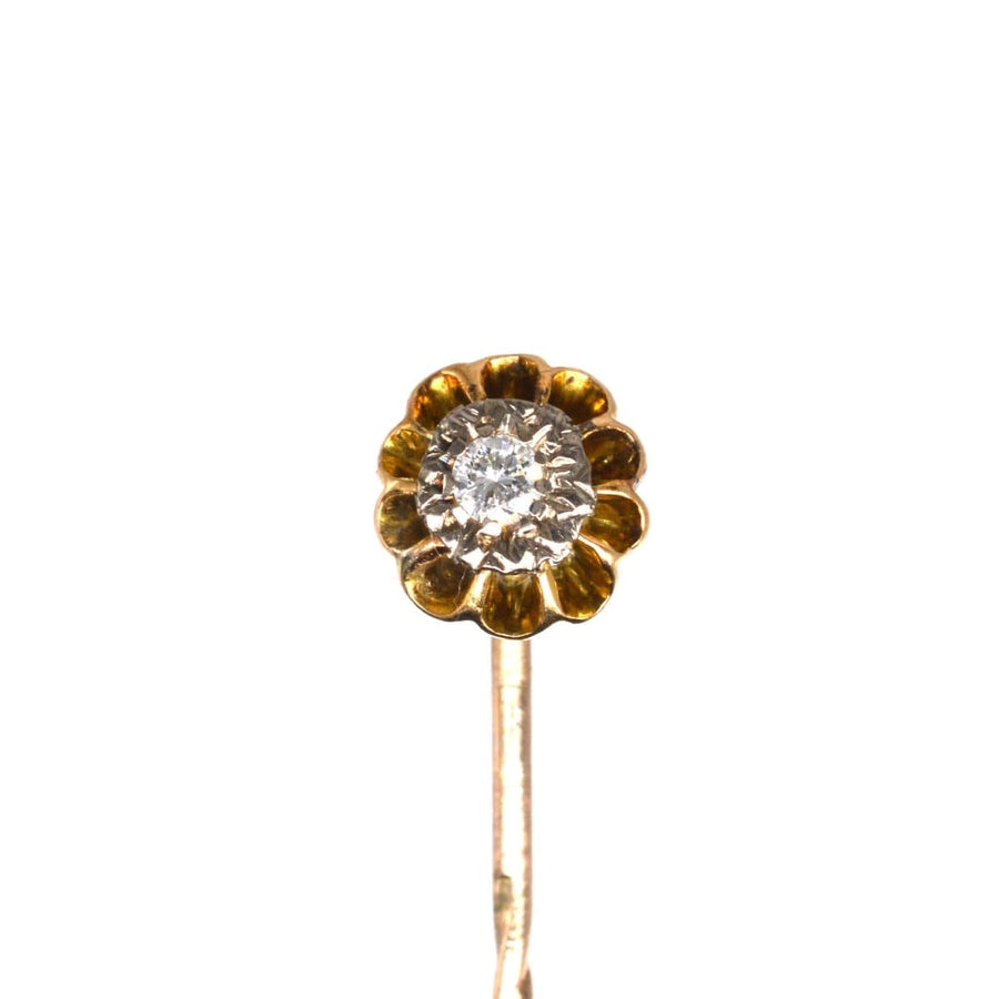Edwardian 15ct gold and platinum diamond tie pin with a claw setting showcasing a brilliant white diamond.