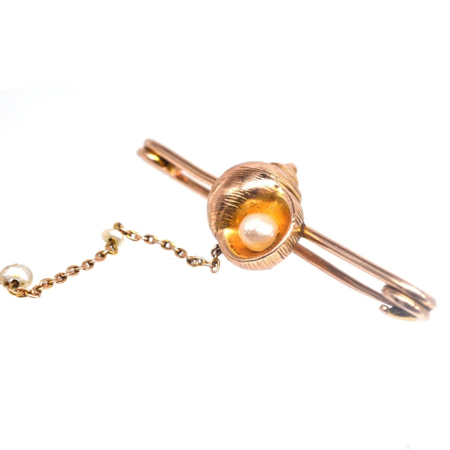 15ct gold bar brooch featuring a seashell and natural pearl, ideal gift for seaside lovers.