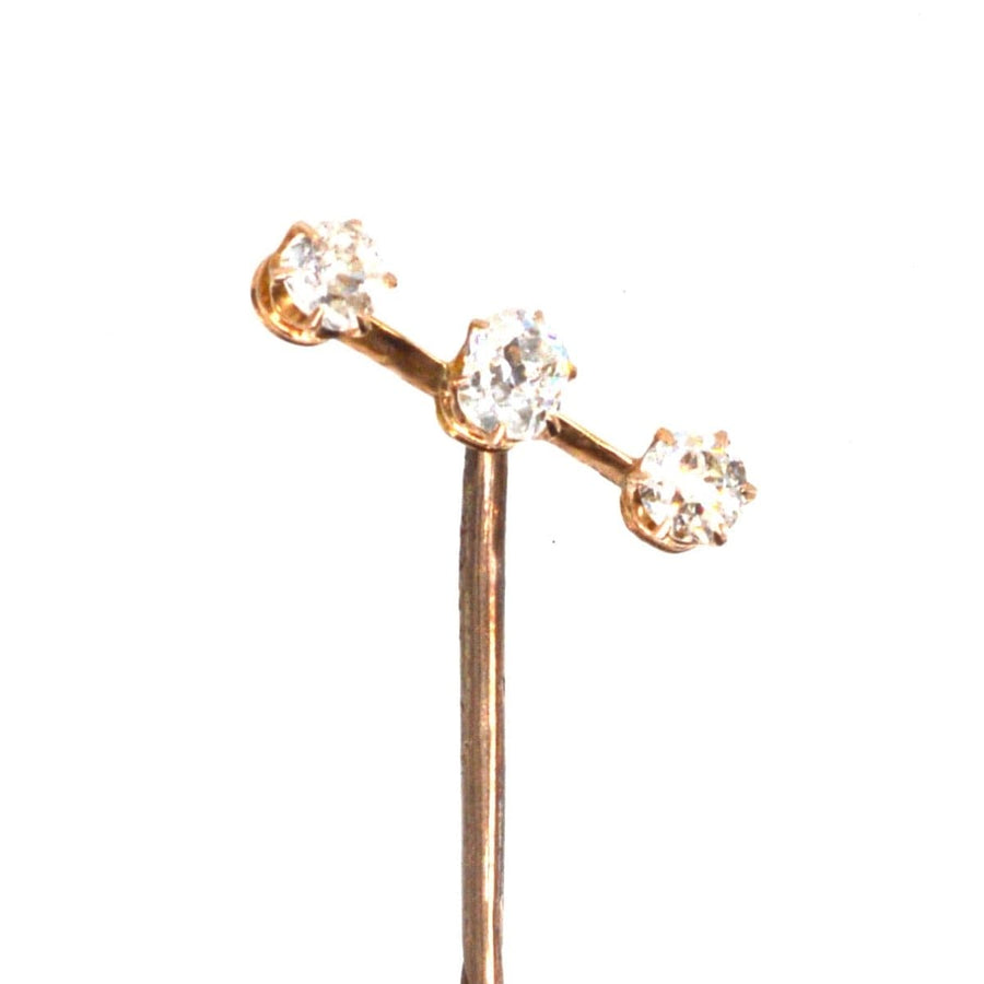 Edwardian 15ct gold three stone diamond tie pin featuring sparkling old cut diamonds.