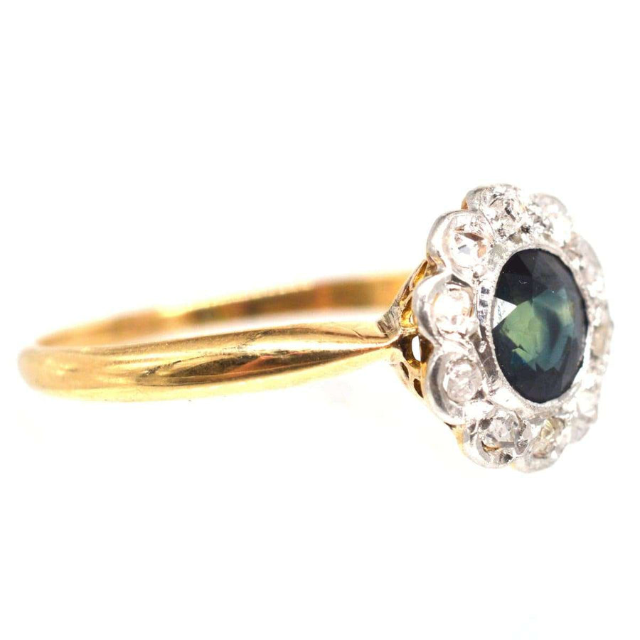 Edwardian 18ct gold teal sapphire and diamond cluster ring, showcasing unique hues and elegant design.