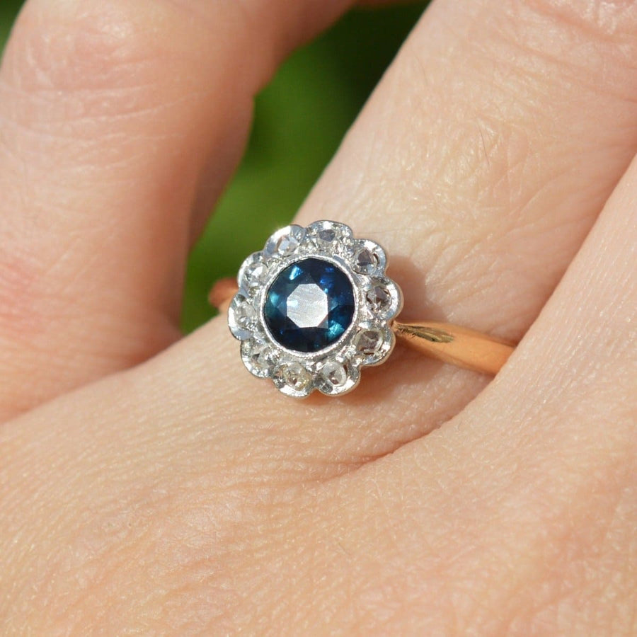 Elegant Edwardian 18ct gold cluster ring featuring blue teal sapphire and diamond accents, perfect for engagements.
