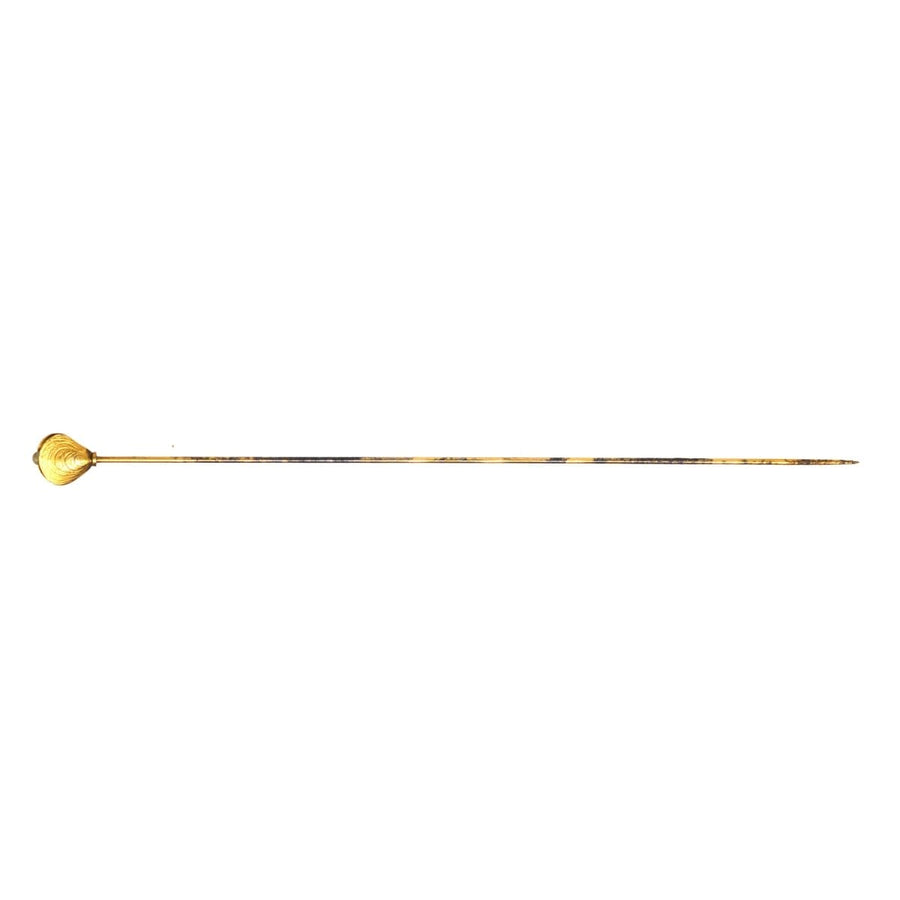 Edwardian 9ct gold oyster shell hat pin with pearl detail, showcasing intricate design and charm.
