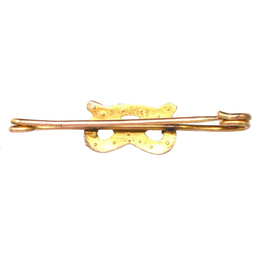 Elegant Edwardian 9ct gold brooch featuring a Stafford knot design and natural split pearls.