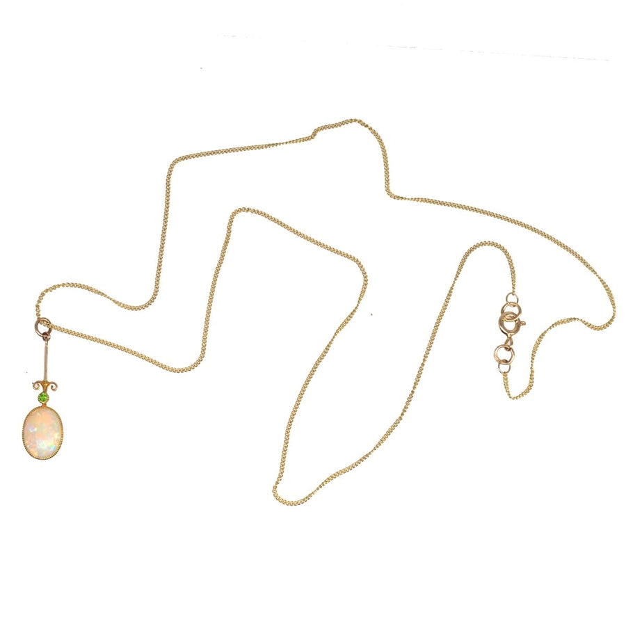 Edwardian opal and green garnet pendant on modern 9ct gold chain, showcasing fine craftsmanship and elegance.