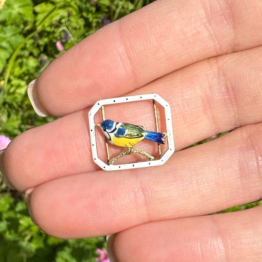 15ct gold enamel buckle featuring a blue tit bird, symbolizing hope and vitality.