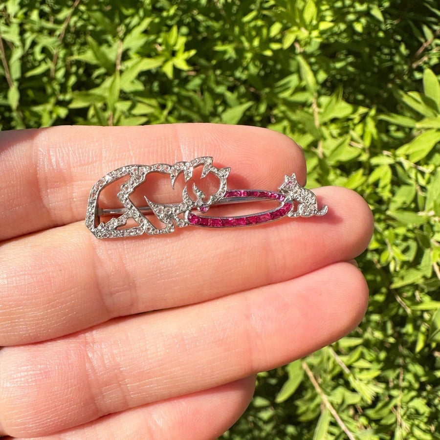 French Art Deco brooch featuring a cat and mouse in rose-cut diamonds and rubies, perfect for animal lovers.