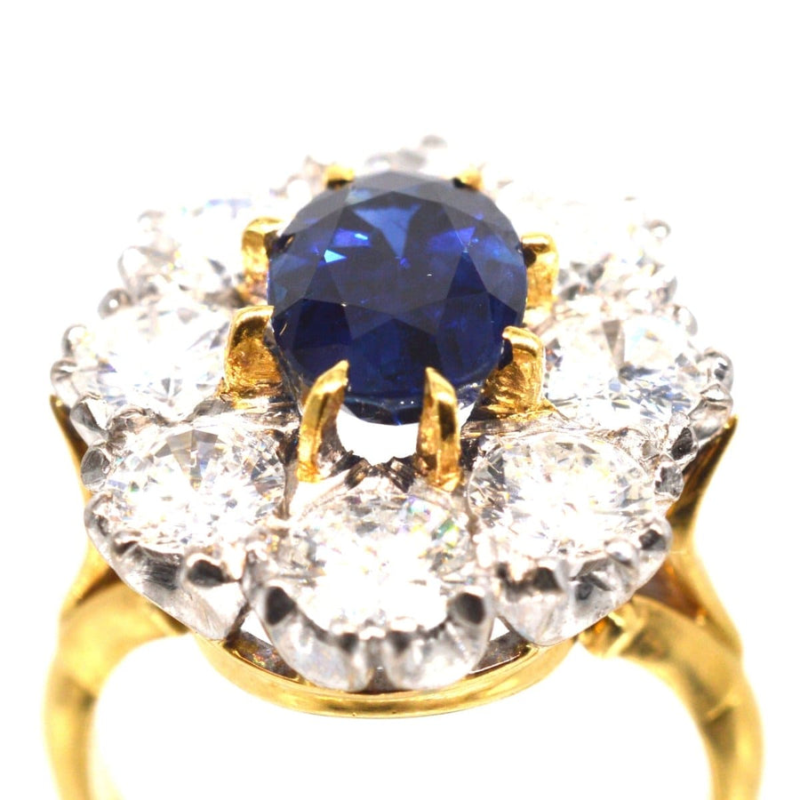 Large mid-century sapphire and diamond cluster ring with a 1.9 carat sapphire surrounded by 4 carats of diamonds.