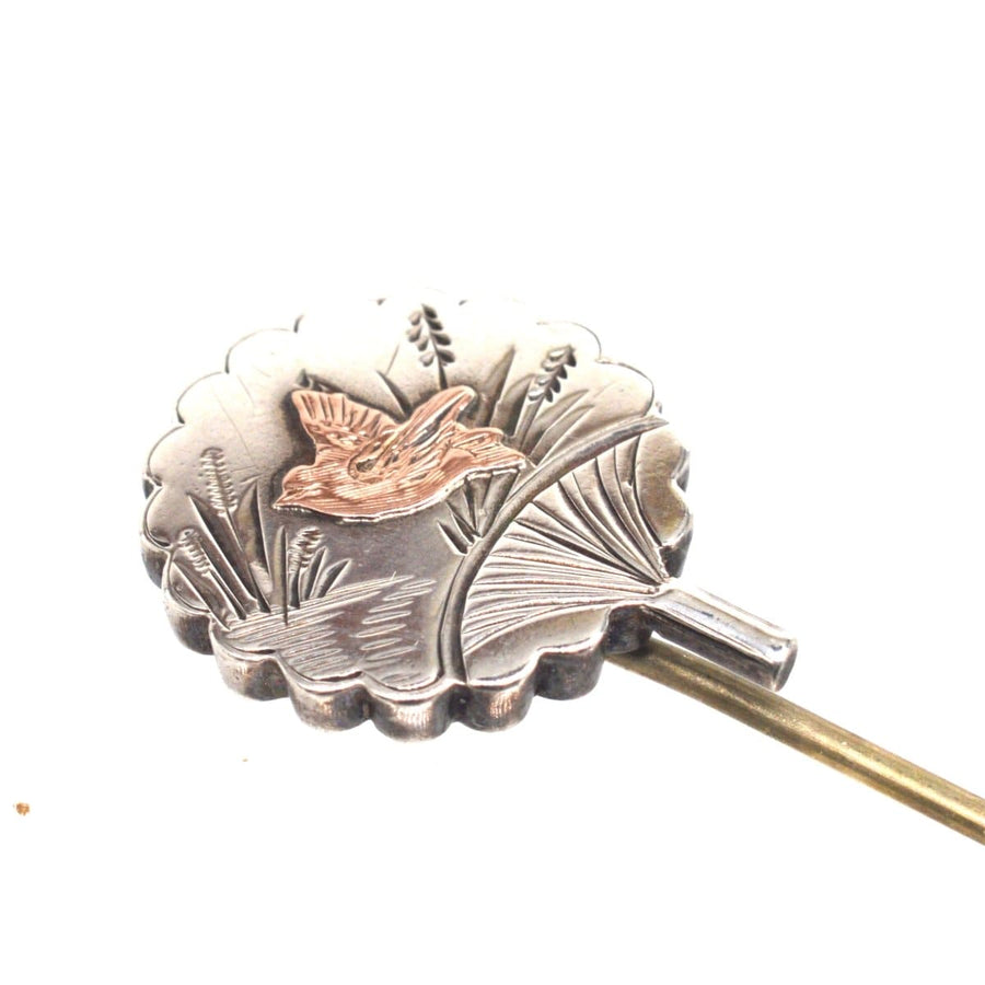 Late 19th century Aesthetic period bird tie pin featuring intricate floral design and a beautiful bird motif.