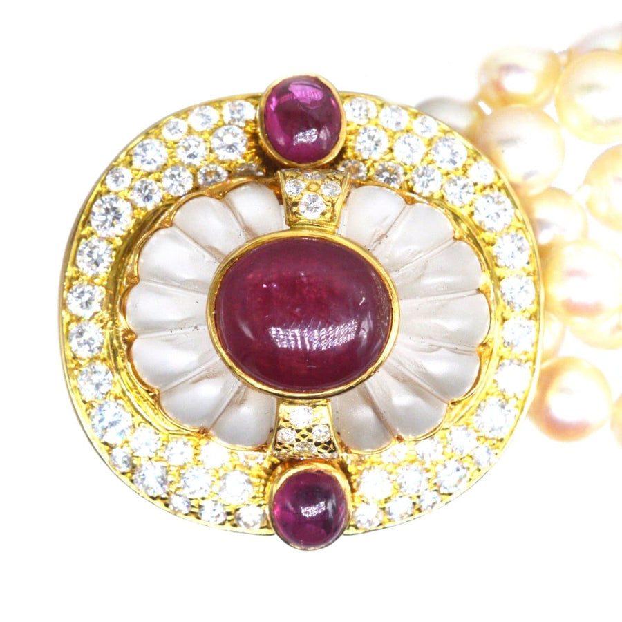 Mid Century French gold necklace clasp with diamonds, rubies, and rock crystal, featuring lustrous cultured pearls.