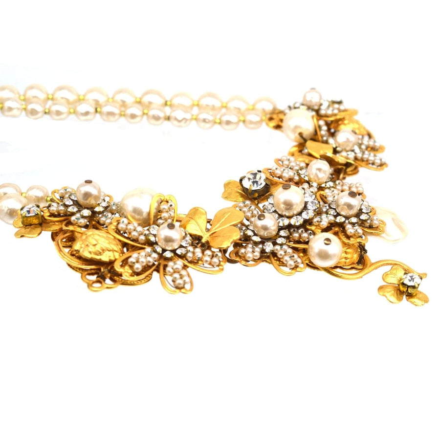 Miriam Haskell signed faux pearl and gold-tone floral necklace with sparkling accents.