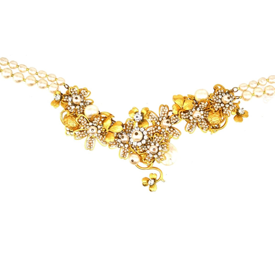 Miriam Haskell faux pearl and gold-tone floral necklace, a vintage costume jewelry piece with intricate designs.