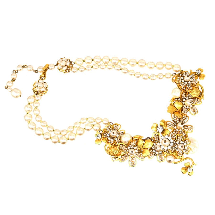 Miriam Haskell signed faux pearl and gold-tone floral necklace, featuring intricate floral designs and elegant pearls.