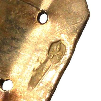 Close-up of stamp on Regency 18ct gold shell carved cameo bracelet, showcasing detailed craftsmanship.