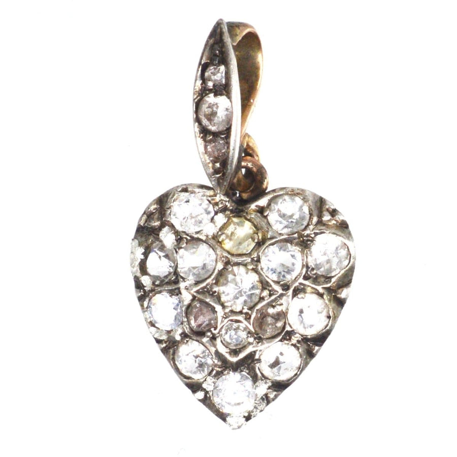 Edwardian gold and silver heart pendant set with sparkling paste, circa 1900s, a charming vintage jewelry piece.