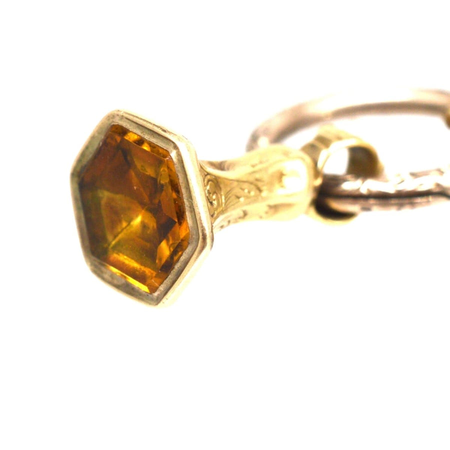 Early Victorian gold seal with hexagon citrine and split ring, showcasing intricate design and elegance.