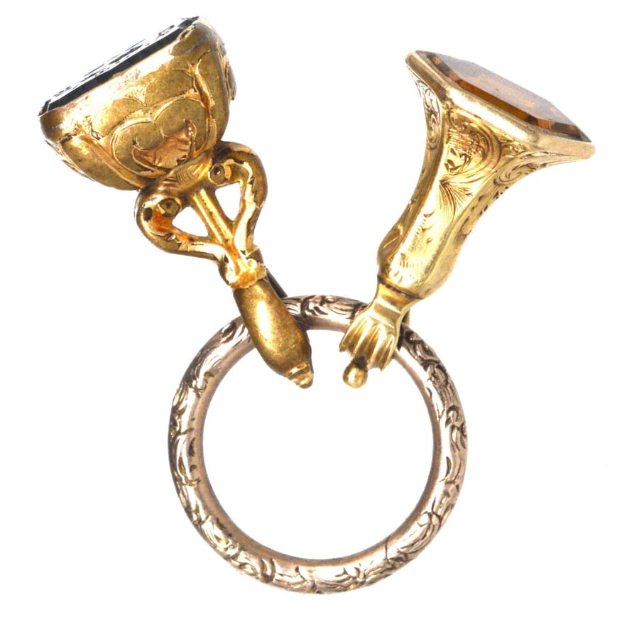 Two early Victorian gold cased seals with a split ring, featuring a citrine and a unique bloodstone seal.