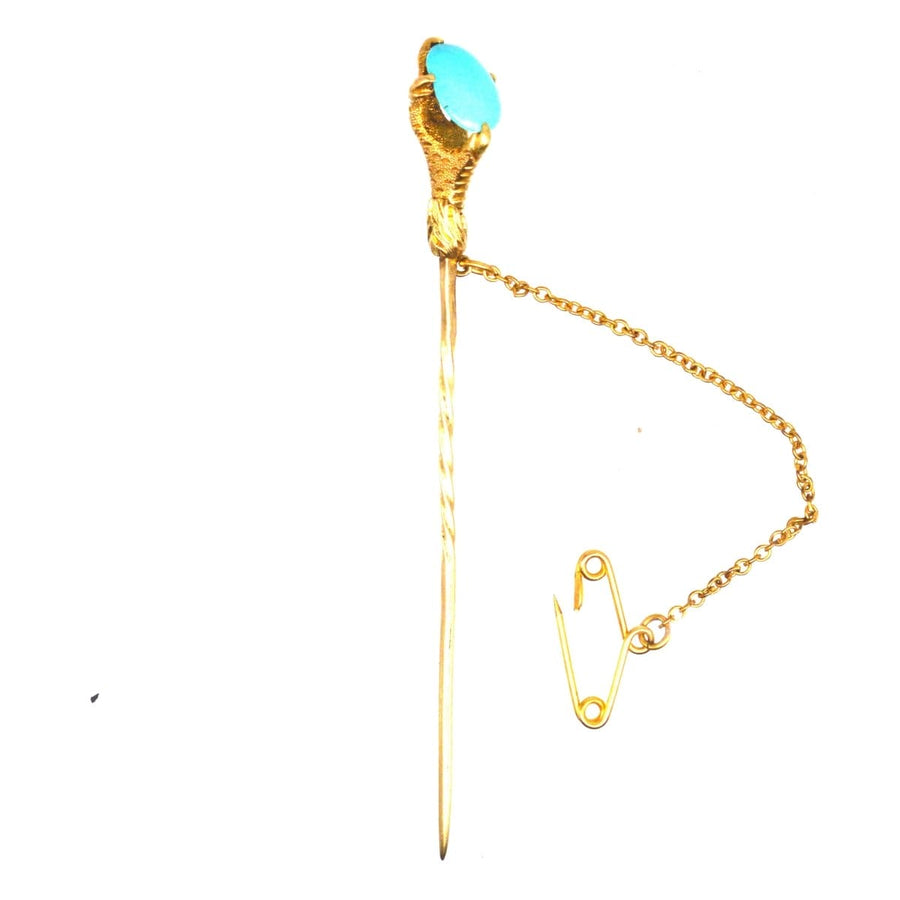 Victorian 15ct gold tie pin featuring an eagle claw holding a turquoise, symbolizing care and thoughtfulness.