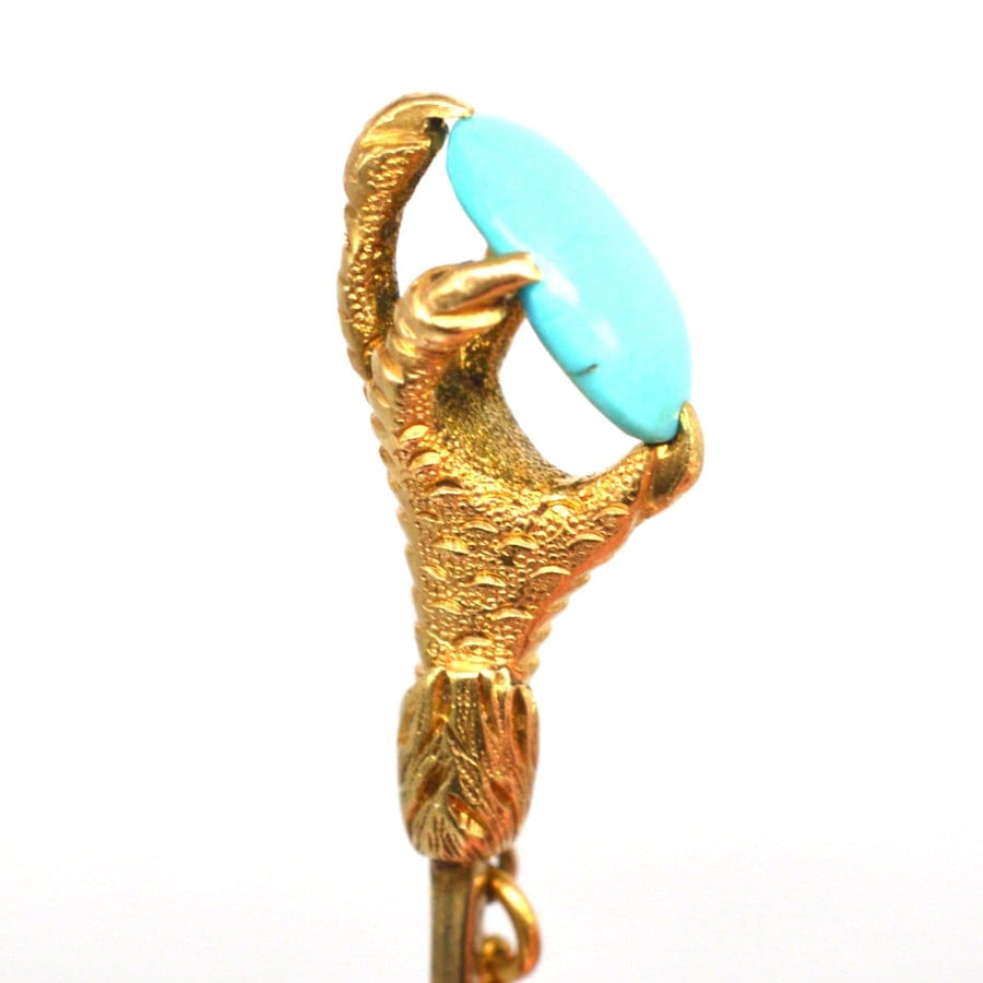 15ct gold tie pin featuring an eagle claw holding a serene turquoise, symbolizing love and sentiment.