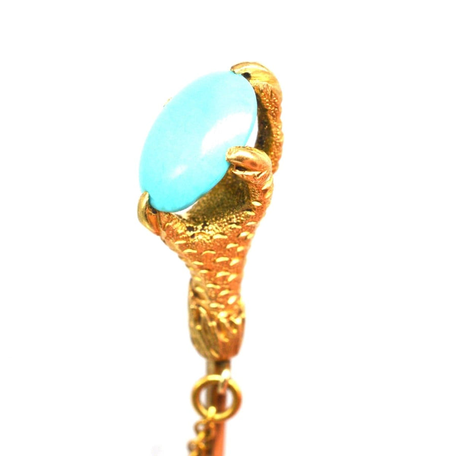 Victorian 15ct gold tie pin featuring an eagle claw gripping a turquoise gem.
