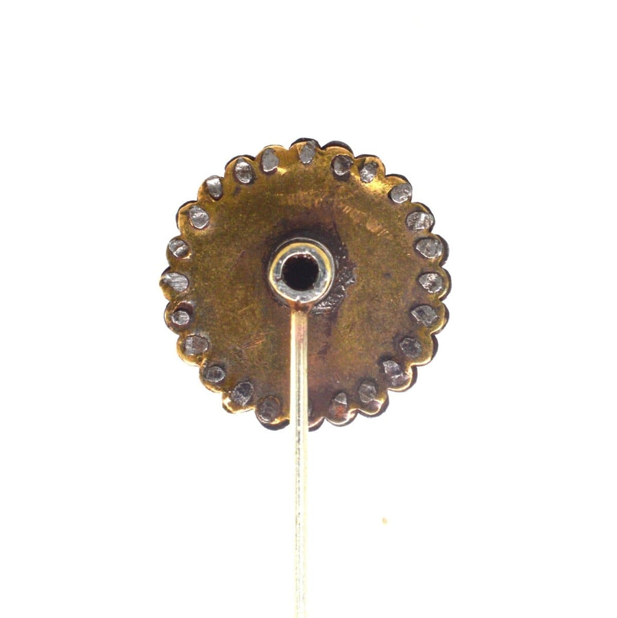 Victorian cut steel tie pin base with carved brown mother of pearl detailing, showcasing intricate design and craftsmanship.