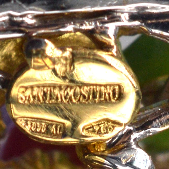 Close-up of Santagostino signature on a vintage 18ct white gold brooch, showcasing craftsmanship and authenticity.