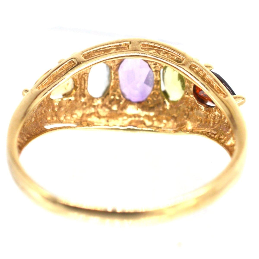 Vintage 9ct gold ring featuring five rainbow gemstones, including citrine, aquamarine, amethyst, peridot, and garnet.