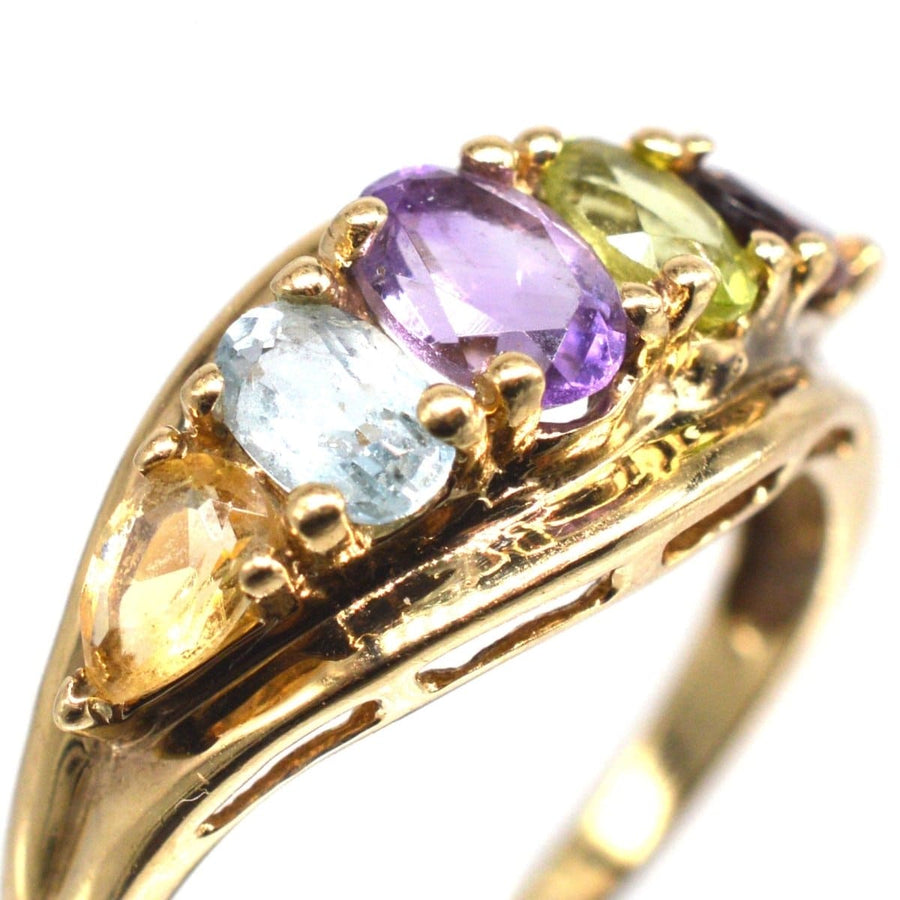 Vintage 9ct gold ring featuring five colorful gemstones: citrine, aquamarine, amethyst, peridot, and garnet.