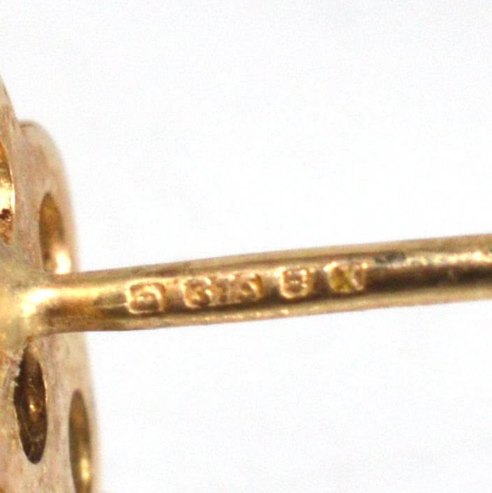 Close-up of stamp on vintage 9ct gold opal cluster stud earrings, showcasing 1984 London mark.