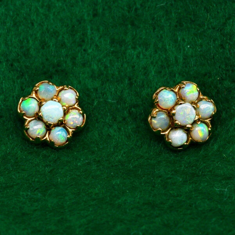 Vintage 9ct gold opal cluster stud earrings showcasing pastel play-of-color, perfect for elegant wear.