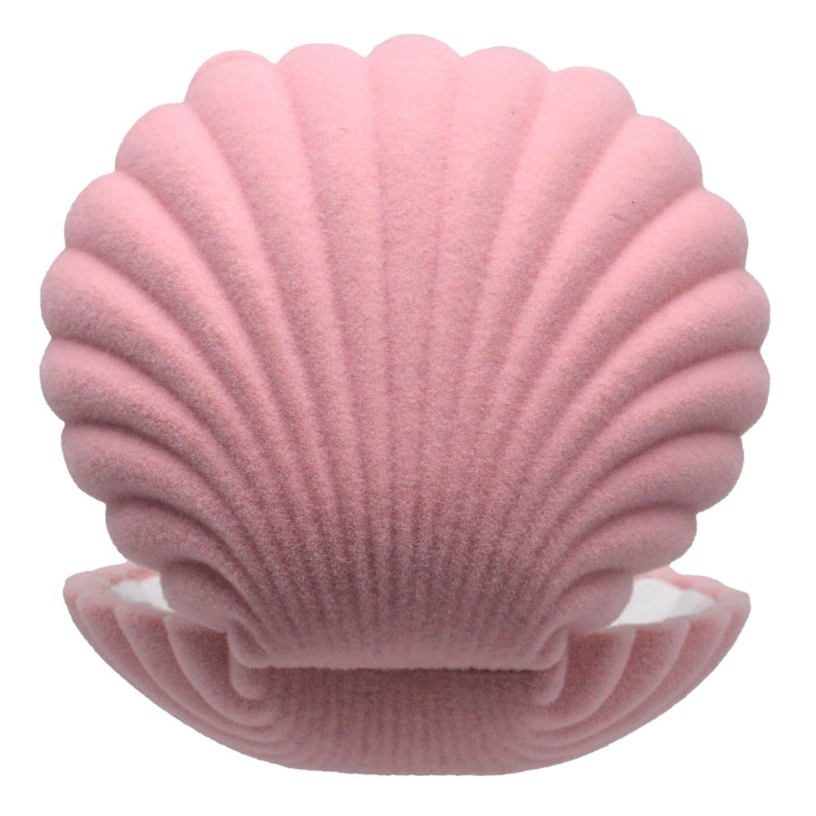 Vintage pink scallop shell jewelry display case for organizing and showcasing smaller pieces of jewelry.