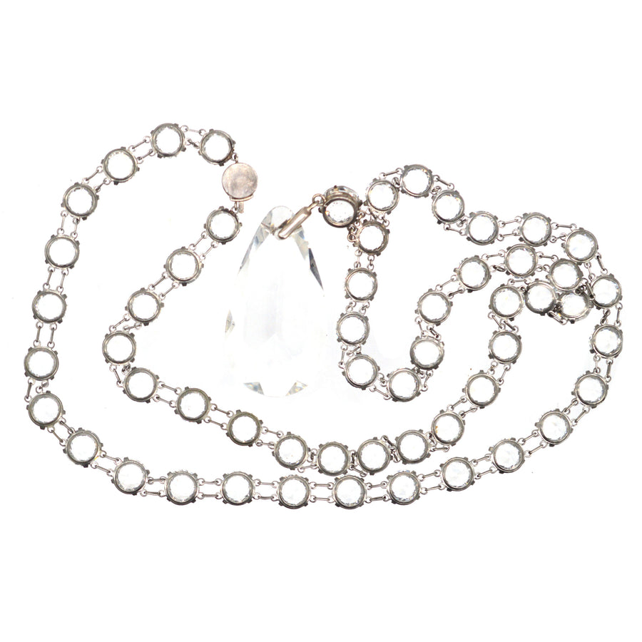 Art Deco silver long necklace with white paste stones and a large paste pear pendant, showcasing fine workmanship and elegance.